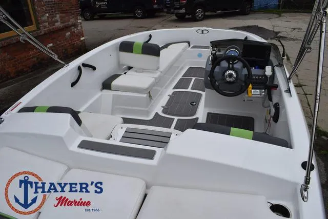 Slide: The Image of 2022 Tahoe T16 boat interior with steering wheel and seating, displayed at Thayer's Marine. - 35