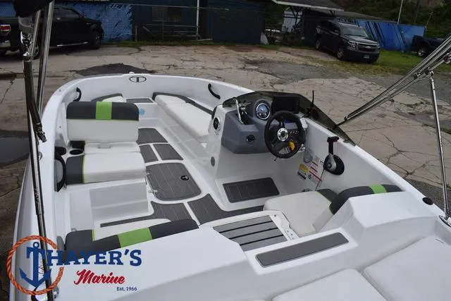 Slide: The Image of 2022 Tahoe T16 boat interior with modern seating and steering, displayed at Thayer's Marine. - 37