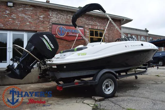 Slide: The Image of 2022 Tahoe T16 boat on trailer at Thayer's Marine dealership. - 43