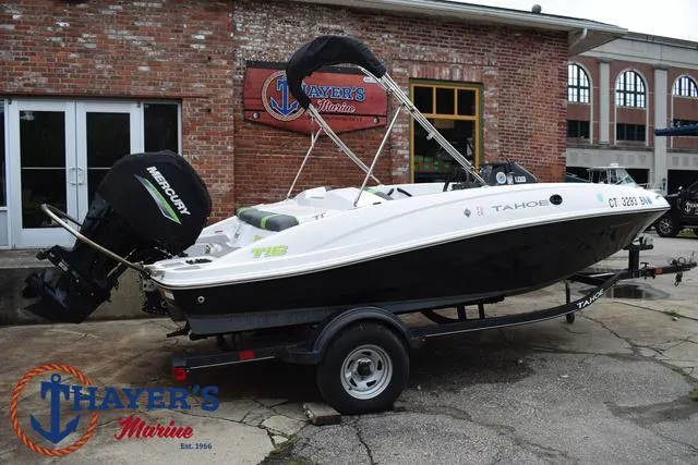 Slide: The Image of 2022 Tahoe T16 boat on trailer at Thayer's Marine dealership. - 44