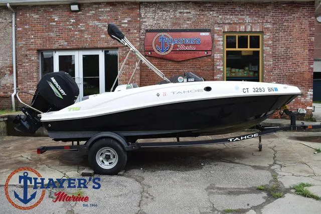 Slide: The Image of 2022 Tahoe T16 boat on trailer at Thayer's Marine dealership. - 45