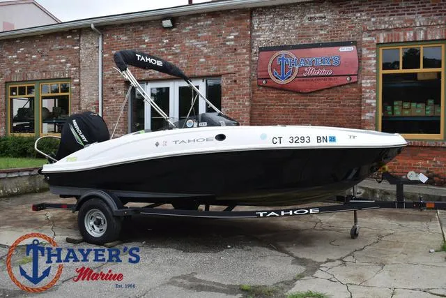 Slide: The Image of 2022 Tahoe T16 boat on trailer at Thayer's Marine dealership. - 46