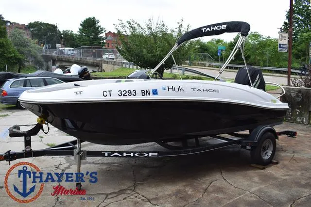 Slide: The Image of 2022 Tahoe T16 boat on trailer at Thayer's Marine dealership. - 9