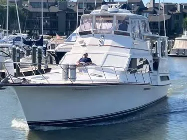 Slide: The Image of 1985 Ocean Yachts 46 Aft Cabin Motor Yacht cruising in a marina. - 1