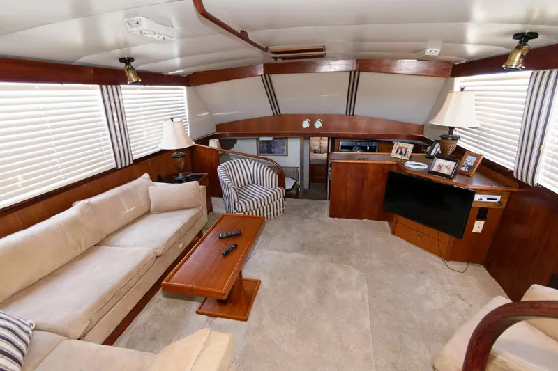 Slide: The Image of Luxurious interior of 1985 Ocean Yachts 46 Aft Cabin Motor Yacht with elegant furnishings. - 13