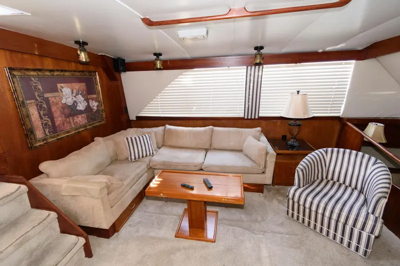 Slide: The Image of Luxurious 1985 Ocean Yachts 46 Aft Cabin Motor Yacht interior with cozy seating and elegant decor. - 14