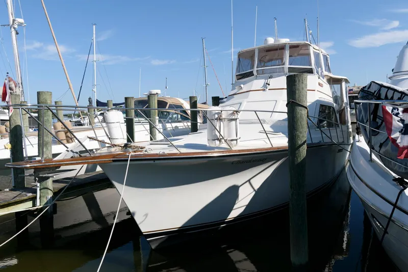 Slide: The Image of 1985 Ocean Yachts 46 Aft Cabin Motor Yacht docked at marina. - 2