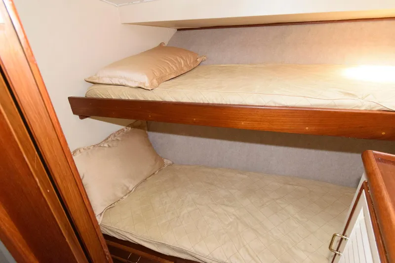Slide: The Image of 1985 Ocean Yachts 46 Aft Cabin Motor Yacht interior with cozy bunk beds. - 23