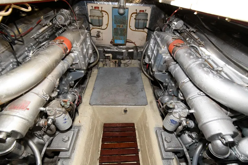 Slide: The Image of Engine room of 1985 Ocean Yachts 46 Aft Cabin Motor Yacht, showcasing dual engines. - 25