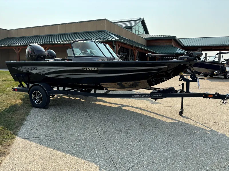 Slide: The Image of 2024 Ranger VS1782SC Angler boat on trailer, parked outdoors. - 2