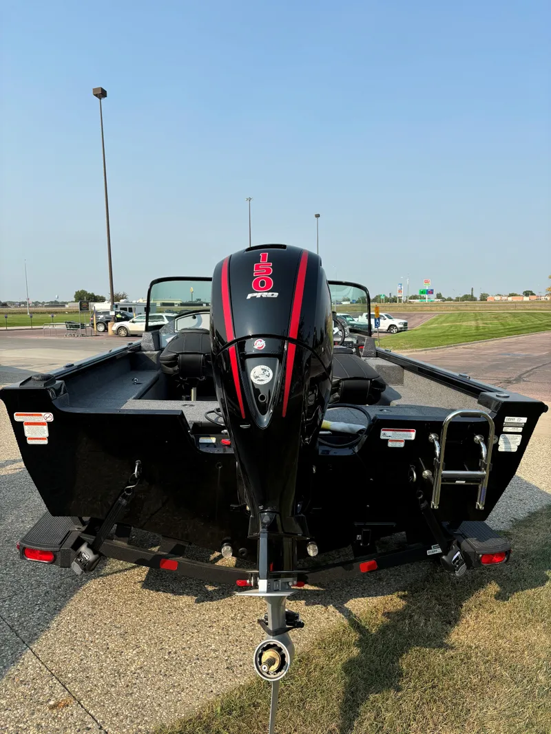 Slide: The Image of 2024 Ranger VS1782SC Angler boat with powerful outboard motor, parked outdoors. - 3