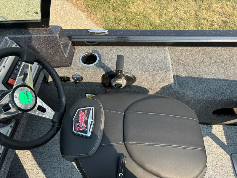 Slide: The Image of 2024 Ranger VS1782SC Angler boat interior with steering wheel and seat. - 7