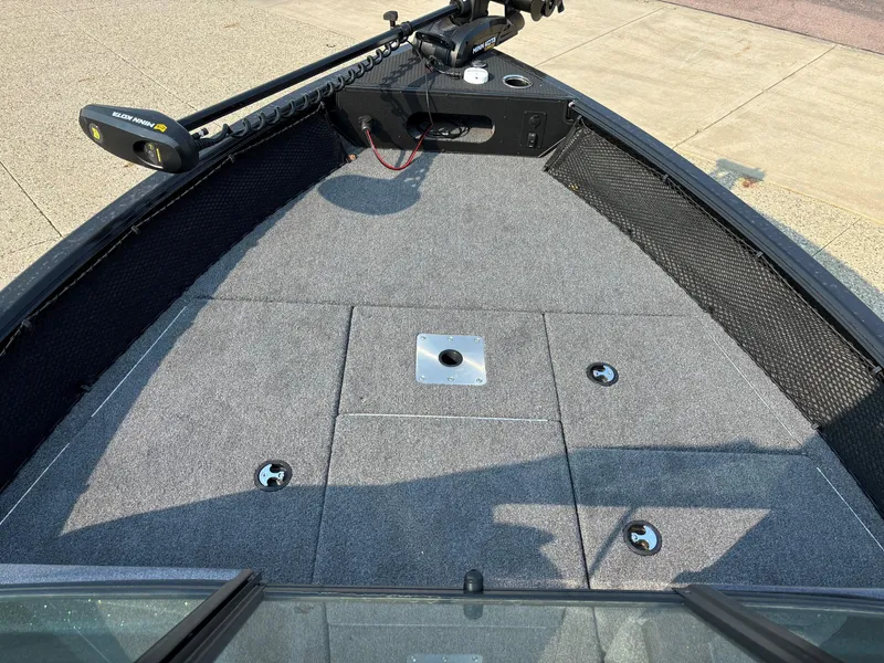 Slide: The Image of 2024 Ranger VS1782SC Angler boat deck with trolling motor and carpeted surface. - 9