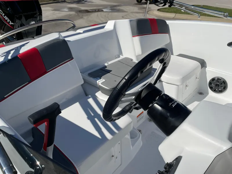 Slide: The Image of 2024 Tahoe T16 boat interior with steering wheel and seating. - 1