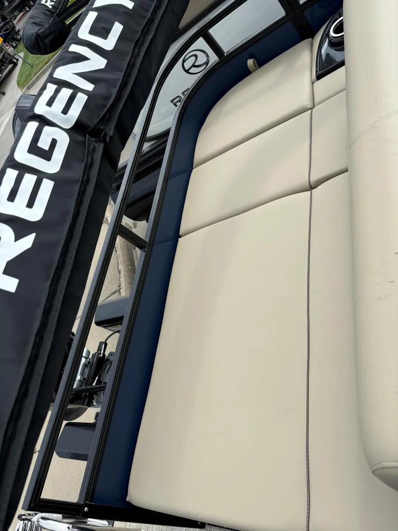 Slide: The Image of 2024 Regency 250 DL3 boat with beige seating and black trim. - 14