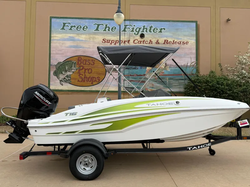 Slide: The Image of 2024 Tahoe T16 boat on trailer, displayed outside Bass Pro Shops. - 2