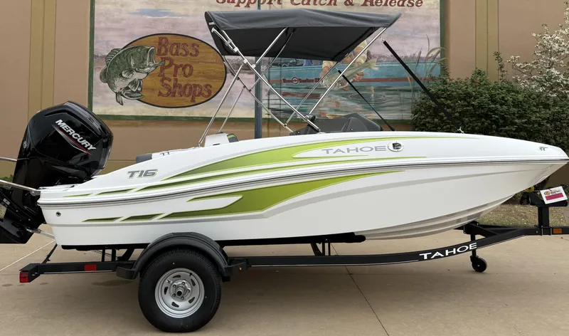 Slide: The Image of 2024 Tahoe T16 boat with green accents on a trailer, displayed at Bass Pro Shops. - 3