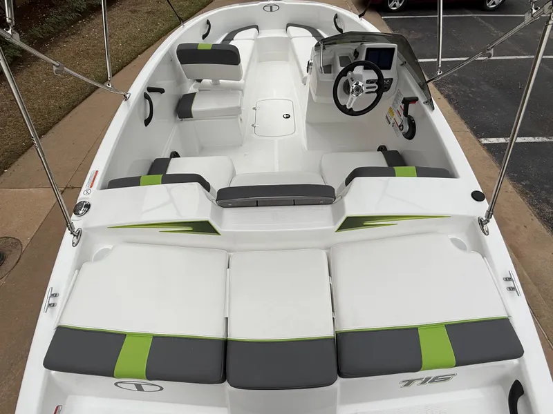 Slide: The Image of 2024 Tahoe T16 boat interior with modern seating and steering console. - 9
