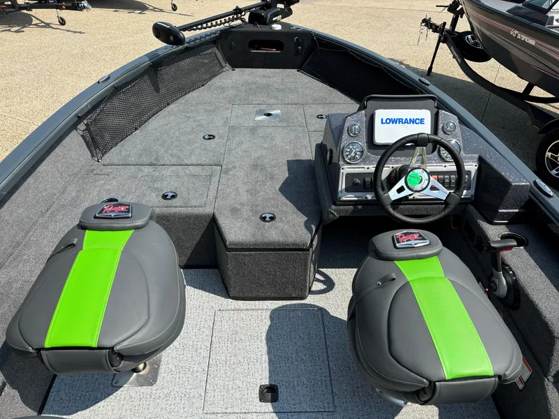 Slide: The Image of 2024 Ranger VS1882SC Angler boat interior with green-accented seats and Lowrance electronics. - 3