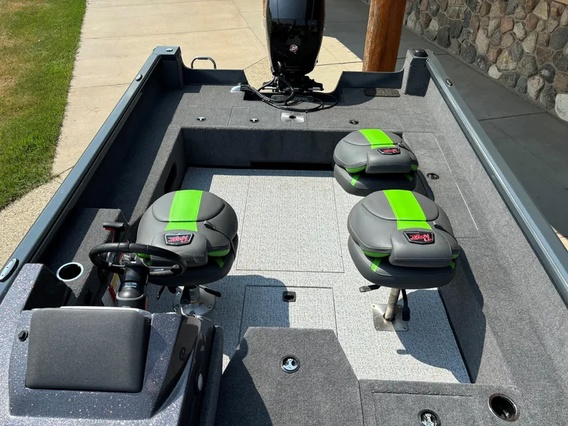 Slide: The Image of 2024 Ranger VS1882SC Angler boat interior with green-accented seats and steering wheel. - 5