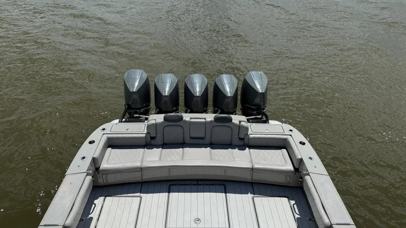 Slide: The Image of 2021 HCB 53 boat with five outboard engines on water. - 13