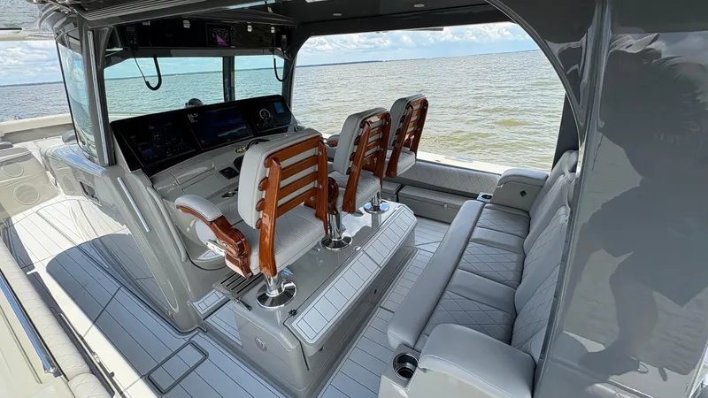 Slide: The Image of Interior of 2021 HCB 53 boat with luxurious seating and advanced navigation system. - 19