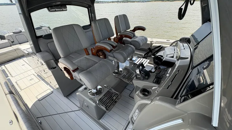 Slide: The Image of Luxurious 2021 HCB 53 boat interior with plush seating and advanced control panel. - 22