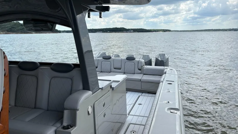 Slide: The Image of Luxury HCB 53 yacht interior on open water, 2021 model, featuring plush seating. - 33