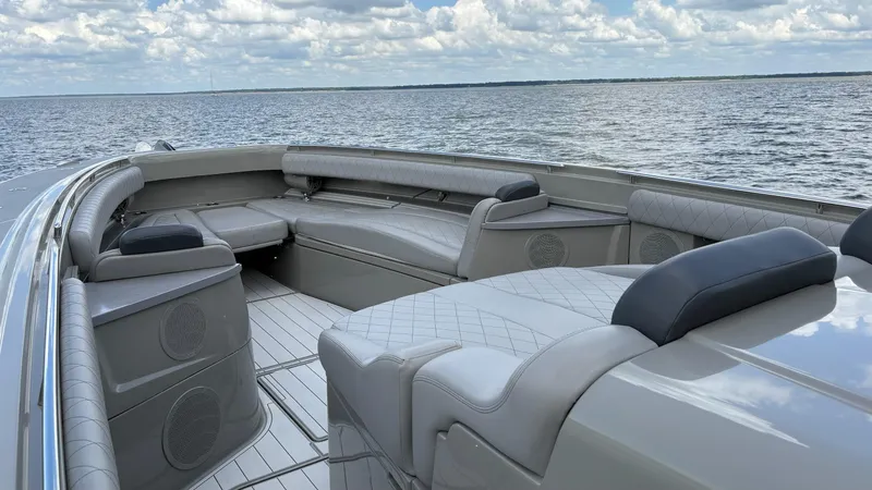 Slide: The Image of Luxurious seating on a 2021 HCB 53 boat, overlooking a serene ocean view. - 37