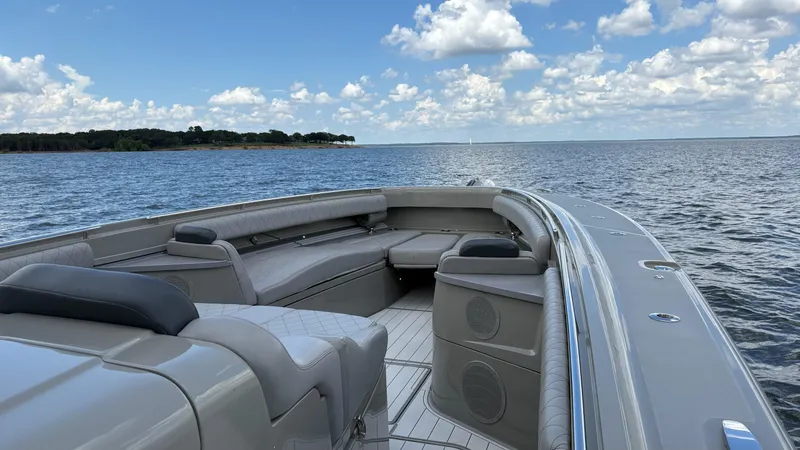 Slide: The Image of Luxurious 2021 HCB 53 boat interior with plush seating on open water. - 38