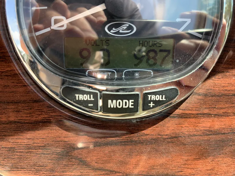 Slide: The Image of Close-up of 2005 Sea Ray 220 Sundeck dashboard showing voltmeter and hour meter readings. - 5