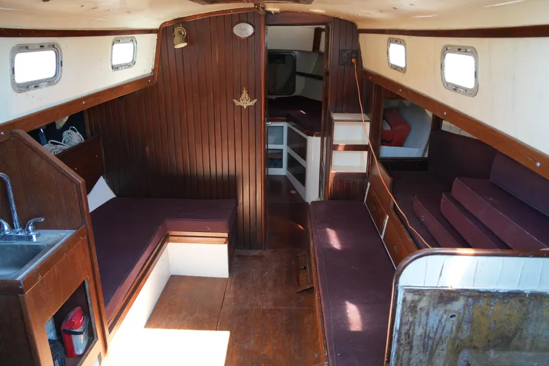 Slide: The Image of Interior of 1970 Cheoy Lee 38A sailboat with wooden paneling and seating. - 19