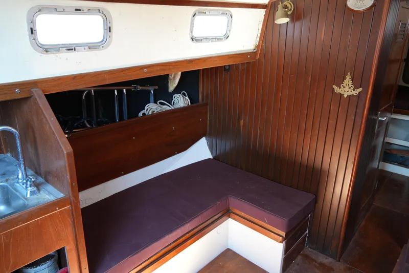 Slide: The Image of Interior of 1970 Cheoy Lee 38A yacht with wooden paneling and seating area. - 22