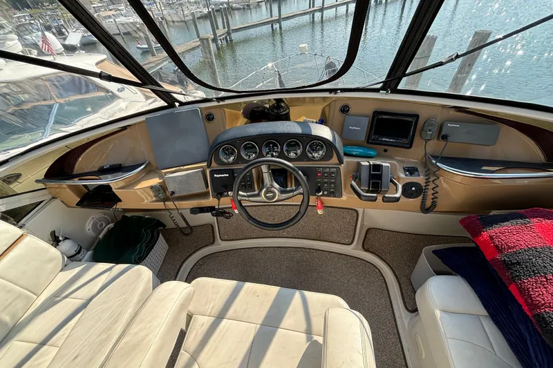 Slide: The Image of Cockpit view of 2002 Carver 444 Cockpit Motor Yacht with steering wheel and navigation instruments. - 14