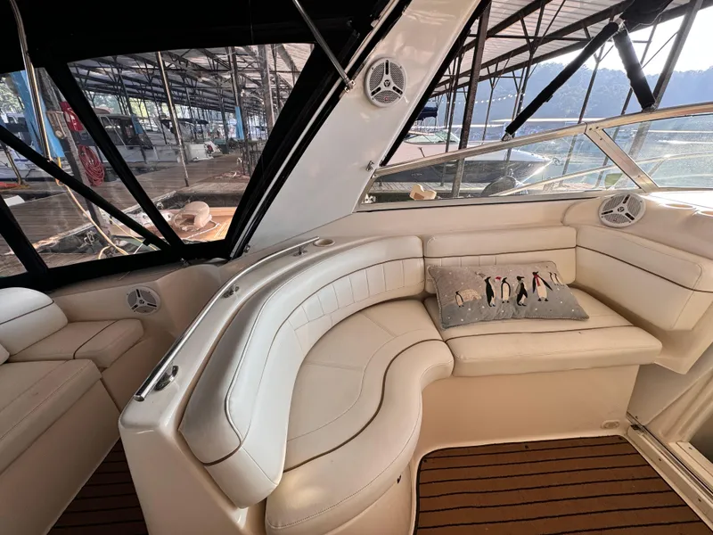 Slide: The Image of Interior of 2002 Rinker Fiesta Vee 342 yacht with white leather seating and decorative pillow. - 29