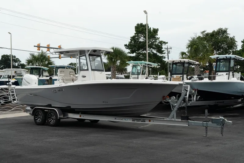The Image of 2023 Blue Wave 2600 Makaira boat on trailer in marina parking lot. - 1