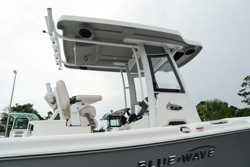 Slide: The Image of 2023 Blue Wave 2600 Makaira boat, side view, showcasing sleek design and modern features. - 13