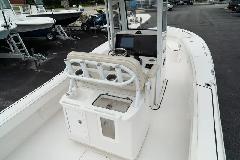 Slide: The Image of 2023 Blue Wave 2600 Makaira boat interior with console and seating. - 15