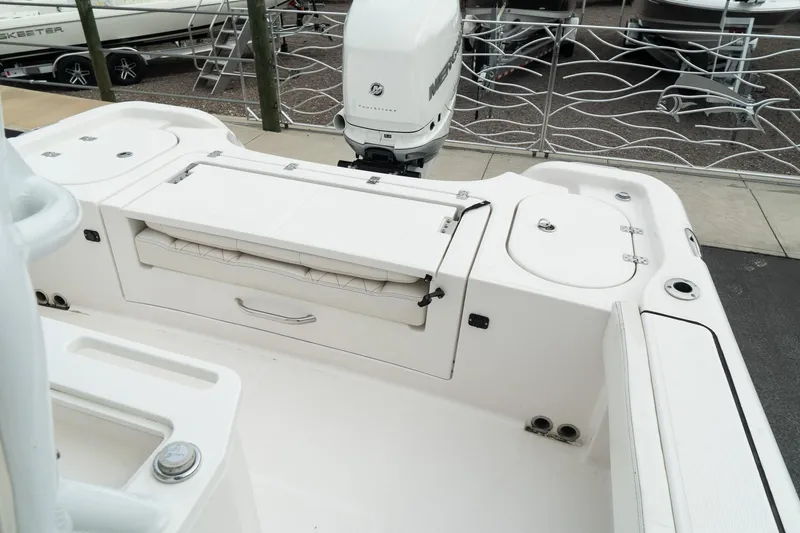 Slide: The Image of 2023 Blue Wave 2600 Makaira boat interior with motor and storage compartments. - 22