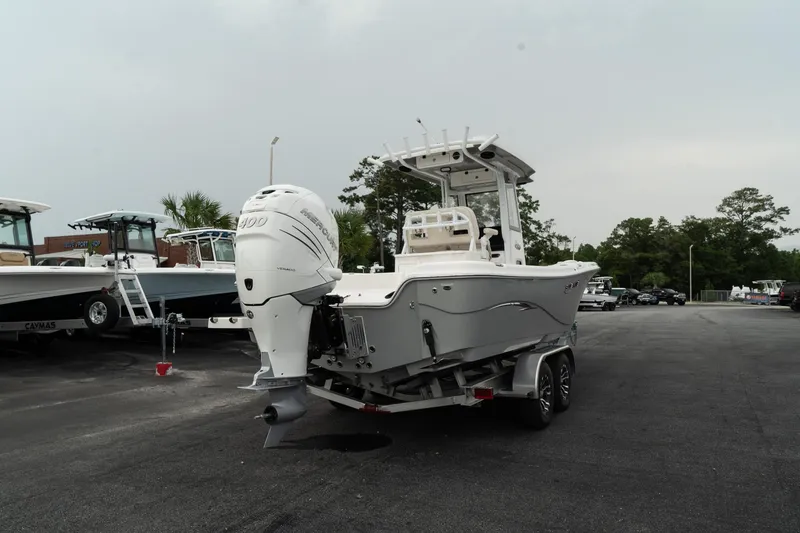 Slide: The Image of 2023 Blue Wave 2600 Makaira boat with outboard motor on trailer. - 8