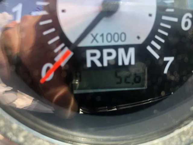 Slide: The Image of Close-up of a 2022 NauticStar 243 DC tachometer showing 526 RPM. - 12
