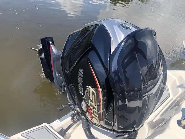Slide: The Image of Yamaha outboard motor on 2022 NauticStar 243 DC boat in water. - 16