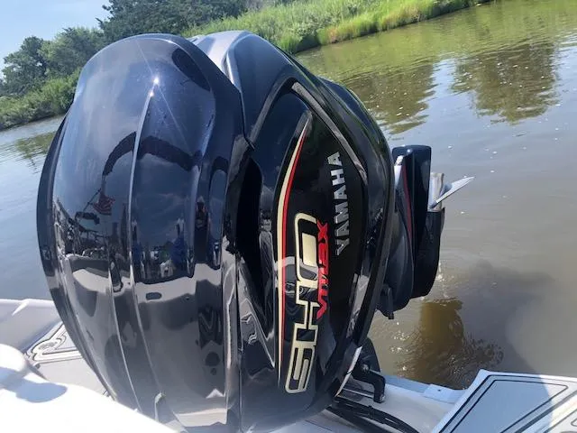 Slide: The Image of 2022 NauticStar 243 DC with Yamaha SHO VMAX engine on calm water. - 17