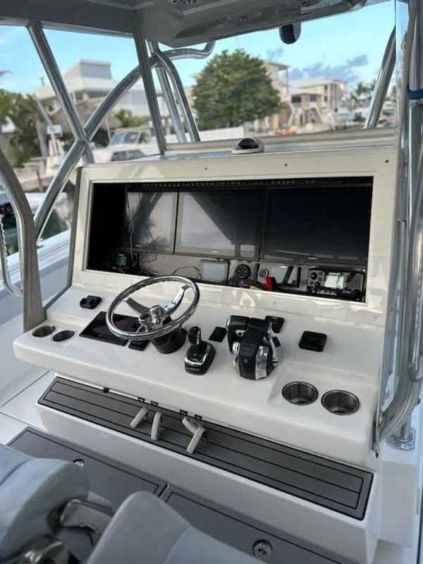 Slide: The Image of 2021 SeaHunter 41 CTS helm with advanced navigation controls and sleek design. - 20