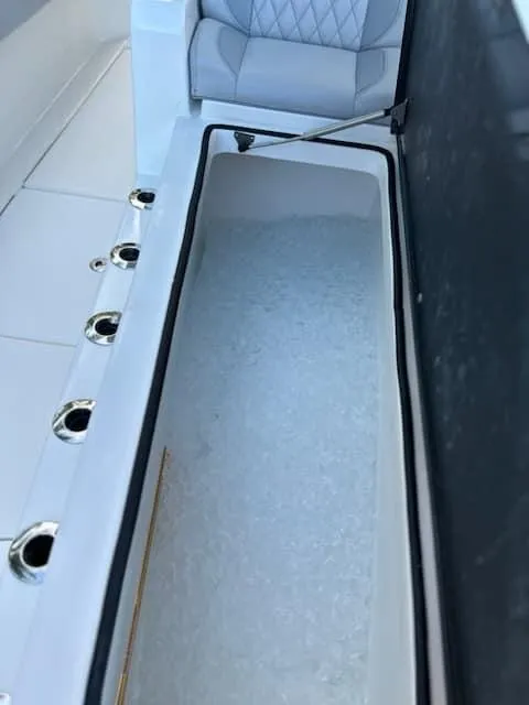 Slide: The Image of 2021 SeaHunter 41 CTS boat with open ice-filled storage compartment. - 22