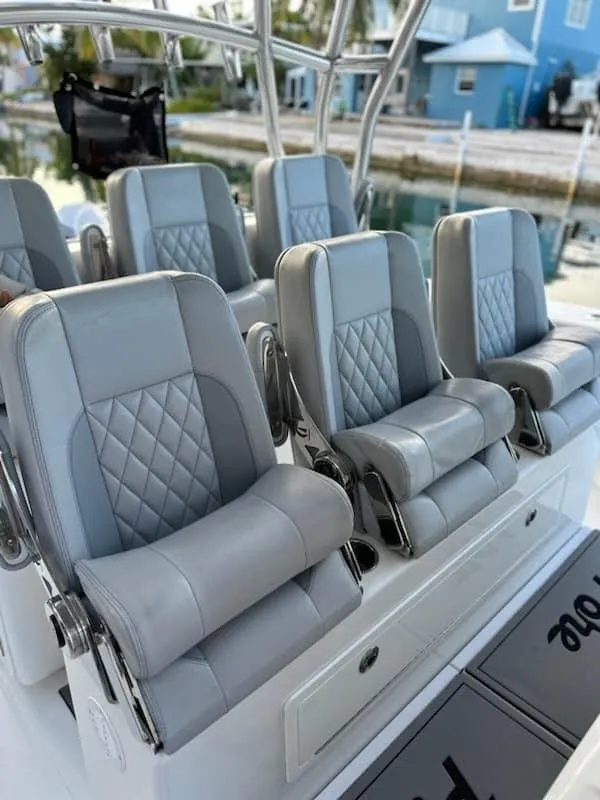 Slide: The Image of Luxury seating on 2021 SeaHunter 41 CTS boat, featuring sleek gray upholstery. - 3