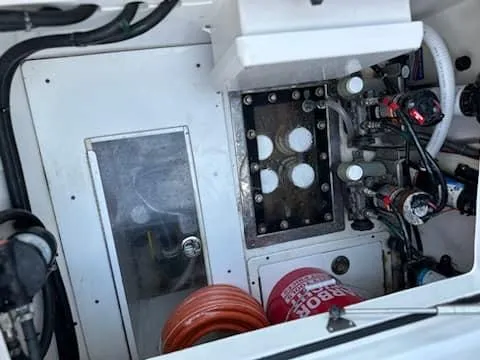 Slide: The Image of Engine compartment of 2021 SeaHunter 41 CTS boat with mechanical components and wiring. - 6