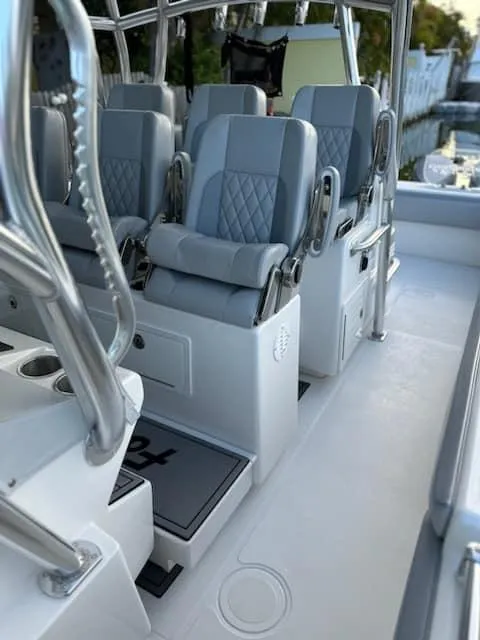 Slide: The Image of 2021 SeaHunter 41 CTS boat interior with luxurious seating and sleek design. - 8
