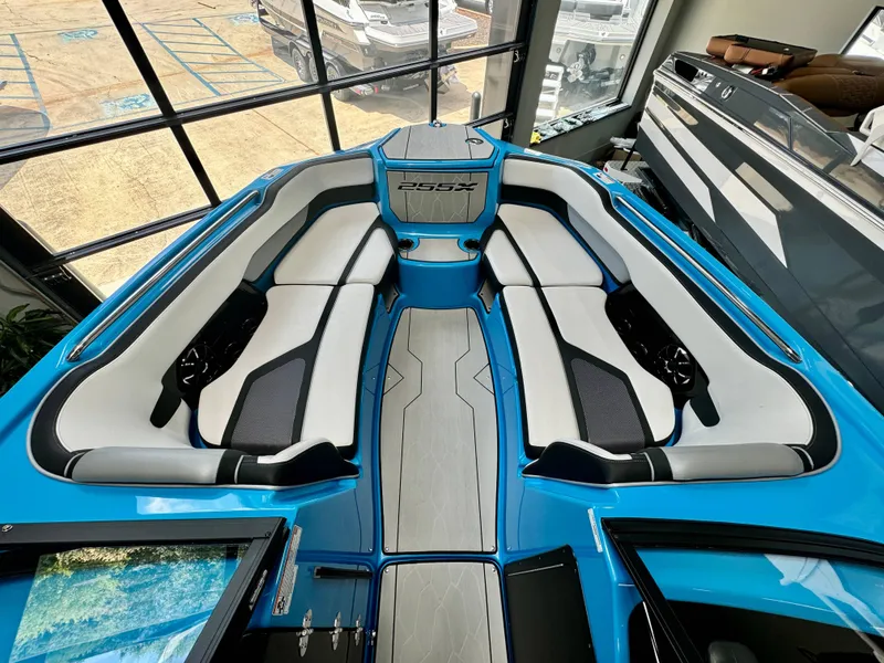 Slide: The Image of Interior view of 2022 Yamaha Boats 255XD, featuring sleek seating and modern design. - 17