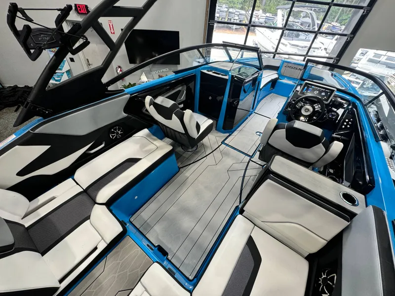 Slide: The Image of Interior of 2022 Yamaha Boats 255XD, featuring sleek seating and modern dashboard design. - 8